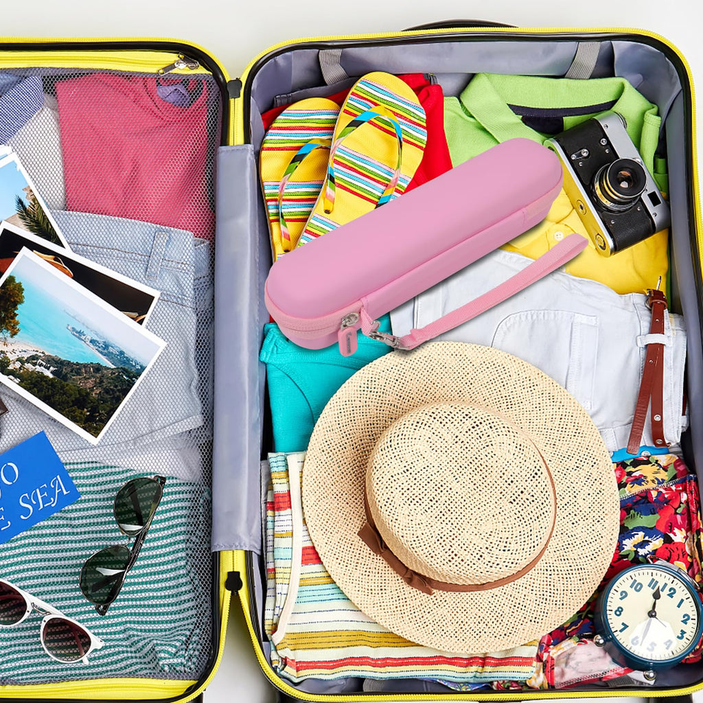 Pink slim electric toothbrush case packed inside a suitcase