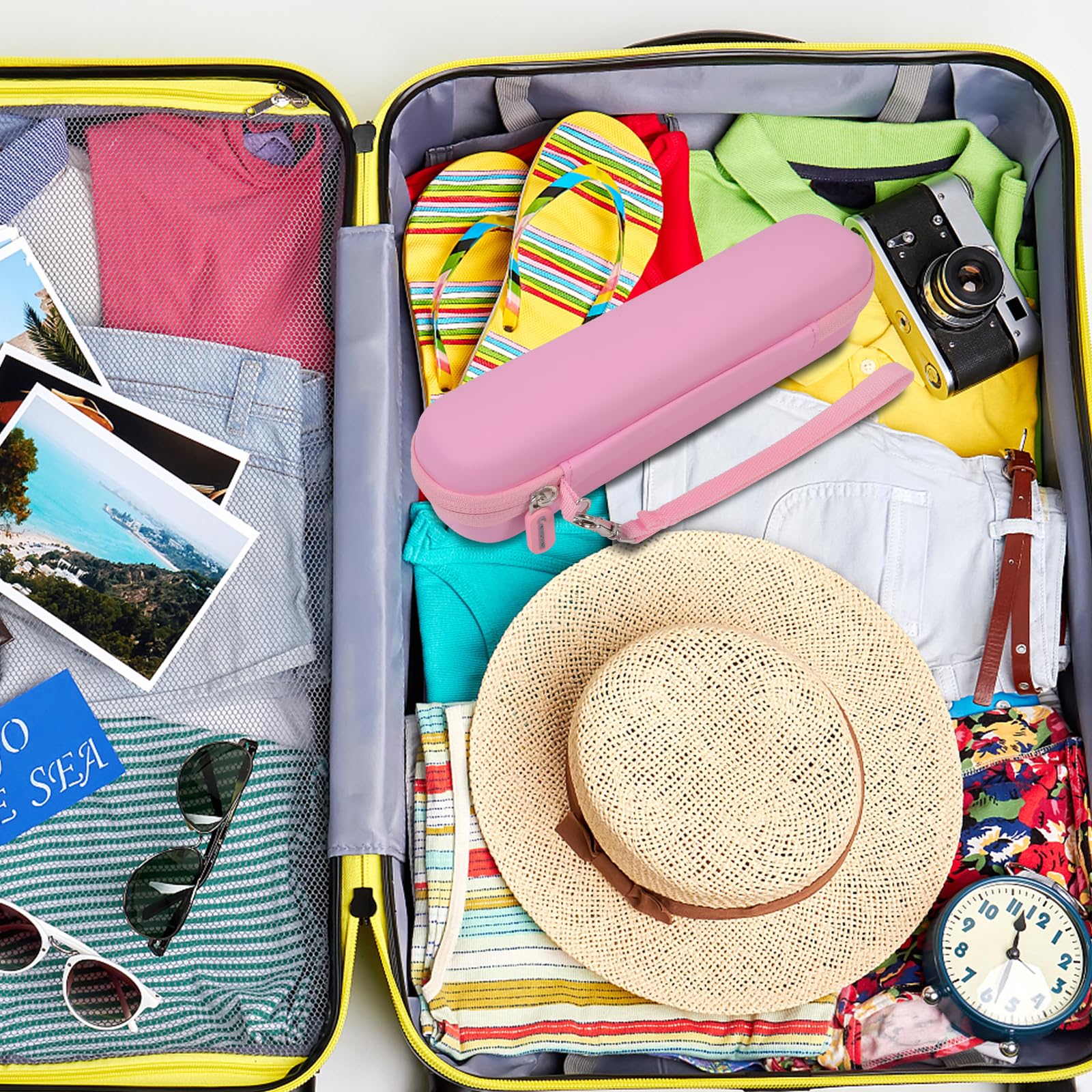 Pink slim electric toothbrush case packed inside a suitcase