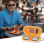 Man checking heart rhythm results beside the open orange KardiaMobile organizer