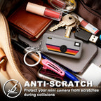 Gray silicone case for Kodak Charmera keychain camera anti-scratch protection shown inside a bag