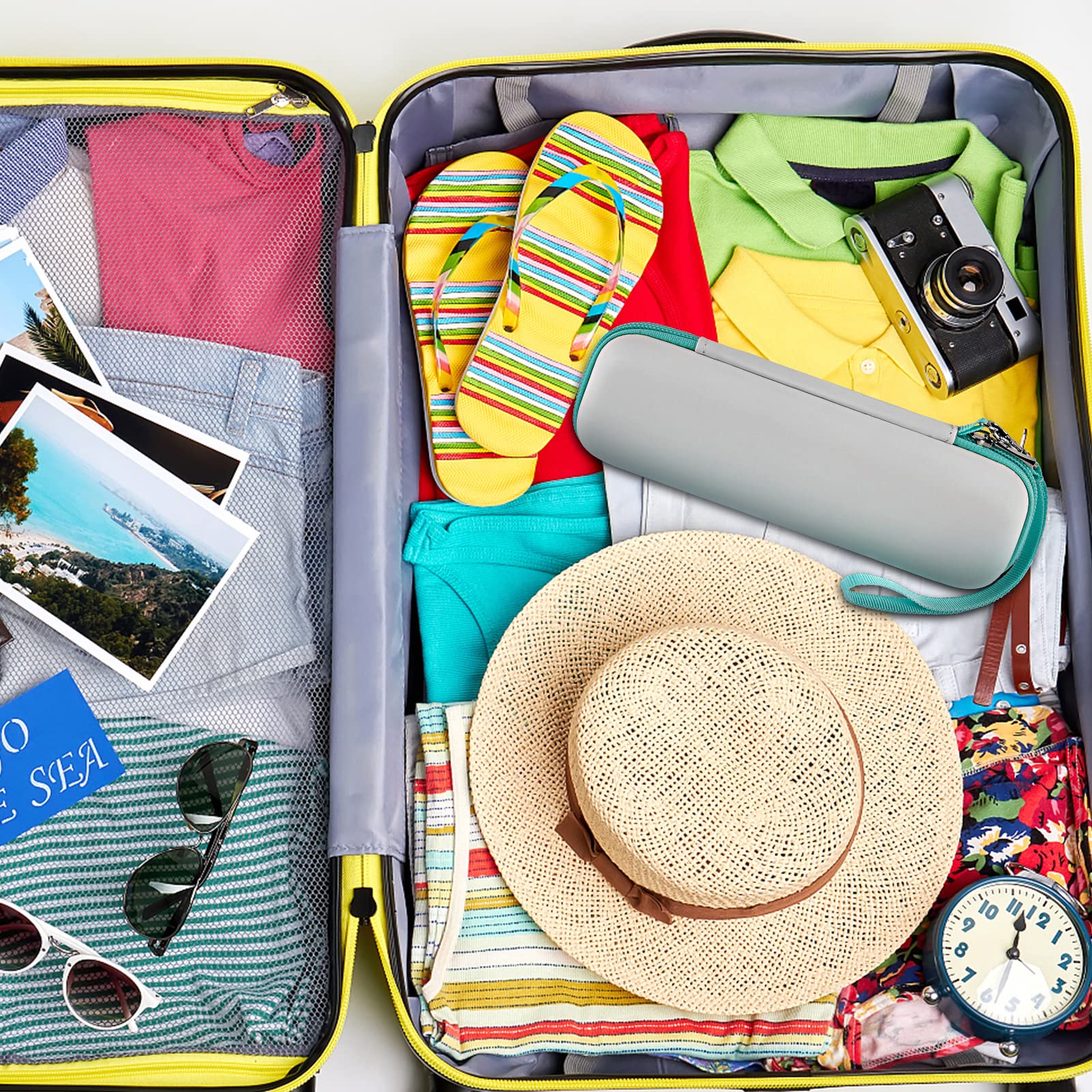 Teal electric toothbrush case packed inside a suitcase